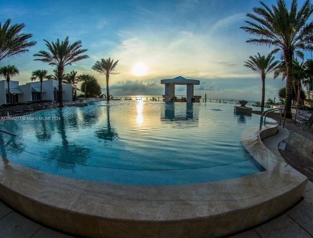 view of community with a water view and a pool