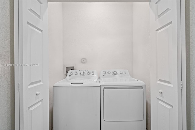 laundry area with washer and clothes dryer