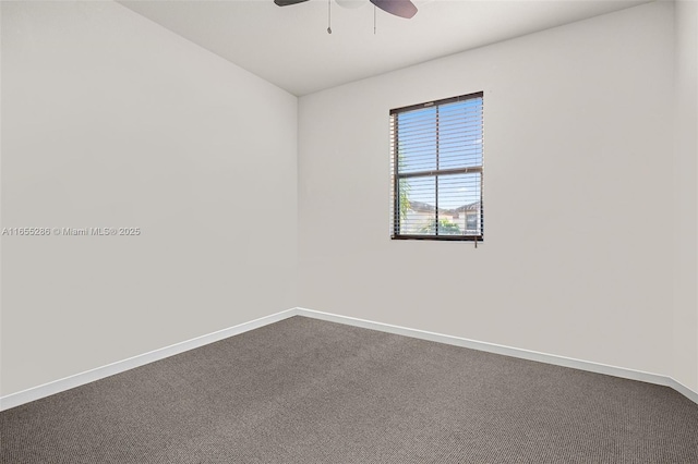 unfurnished room with ceiling fan and carpet