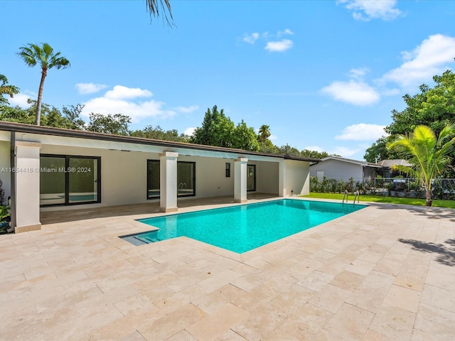 view of pool featuring a patio area