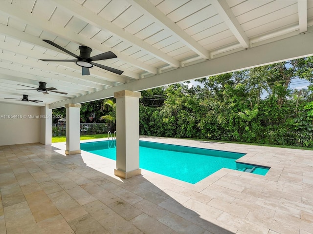 view of pool with a patio and ceiling fan