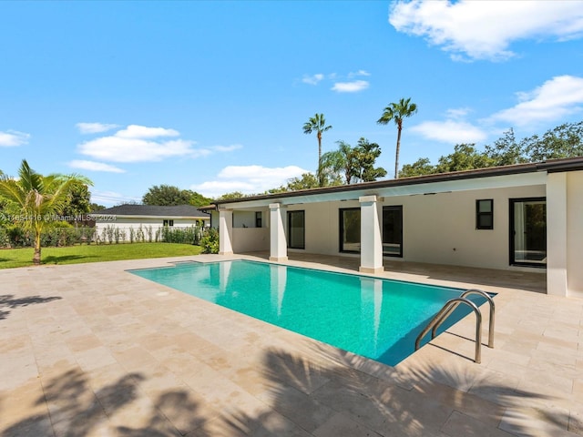 view of swimming pool featuring a patio