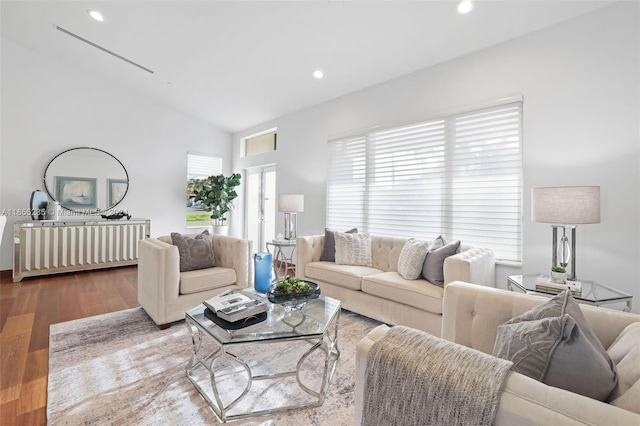 living room with lofted ceiling and light wood-type flooring