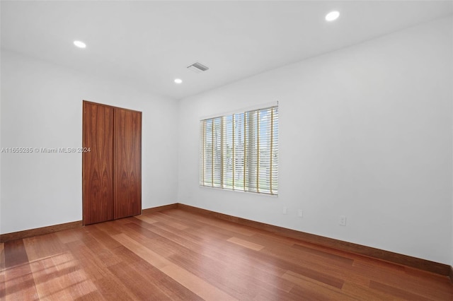 spare room with light wood-type flooring