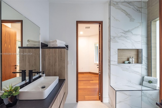 bathroom with hardwood / wood-style floors and vanity