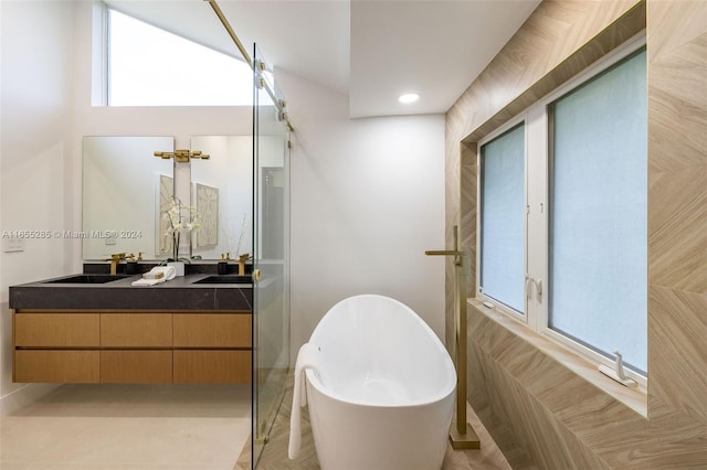 bathroom with a bathing tub and vanity