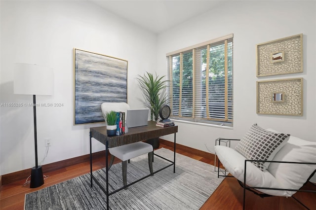 home office with hardwood / wood-style flooring