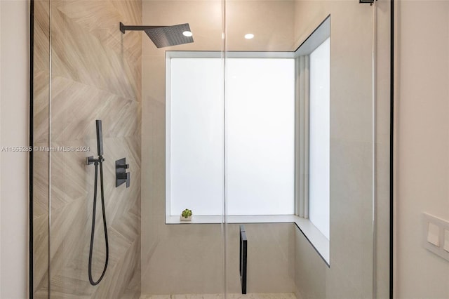 bathroom with tiled shower