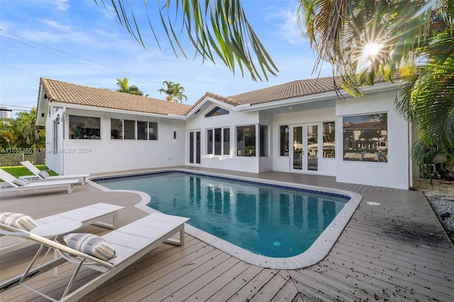 view of pool with a wooden deck