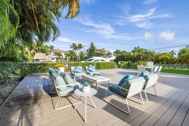 wooden terrace featuring outdoor lounge area