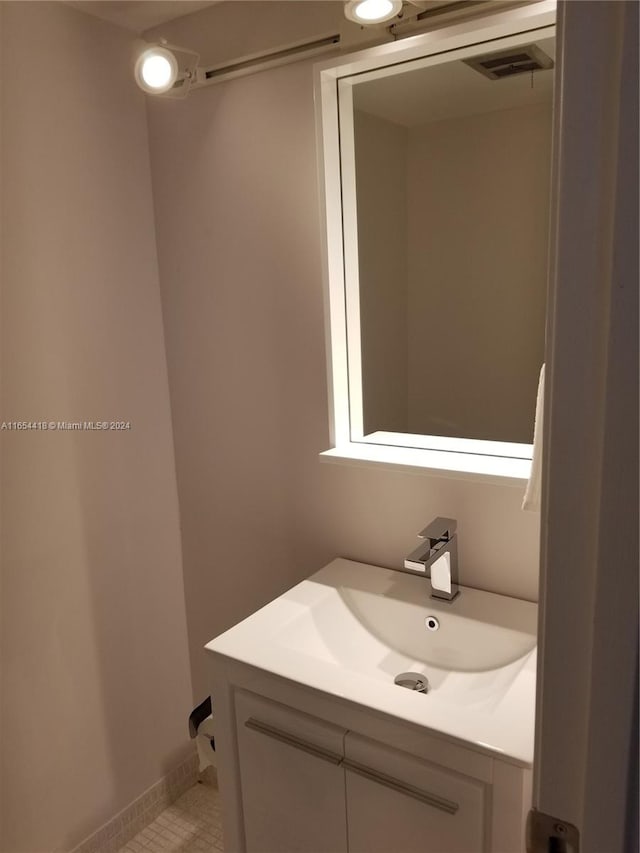 bathroom with vanity and tile patterned floors