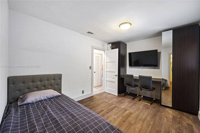 bedroom featuring hardwood / wood-style flooring