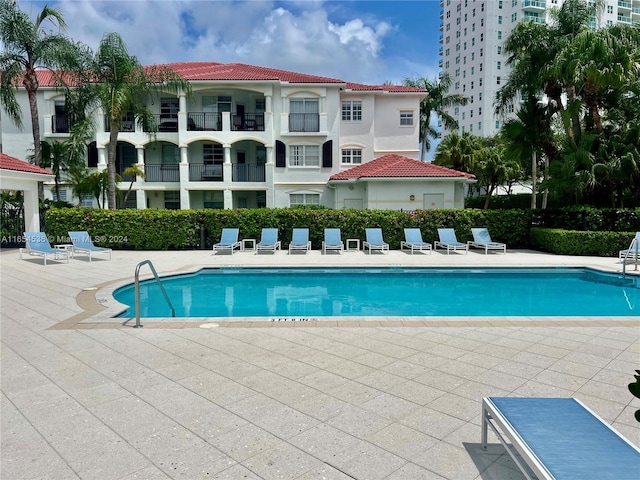 view of swimming pool with a patio