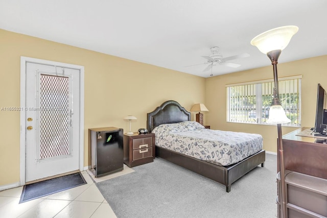 bedroom featuring ceiling fan and tile patterned floors