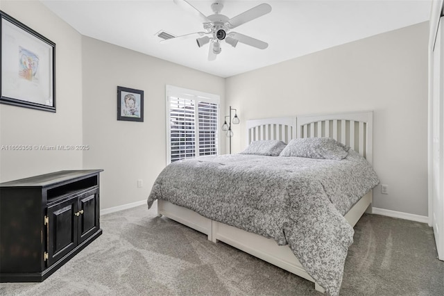 carpeted bedroom with baseboards, visible vents, and ceiling fan