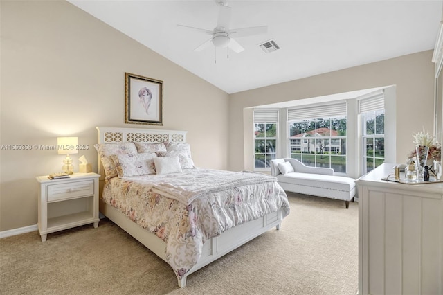 bedroom featuring a ceiling fan, lofted ceiling, light carpet, and visible vents