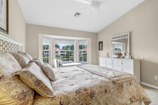 bedroom with lofted ceiling, light colored carpet, visible vents, ceiling fan, and baseboards