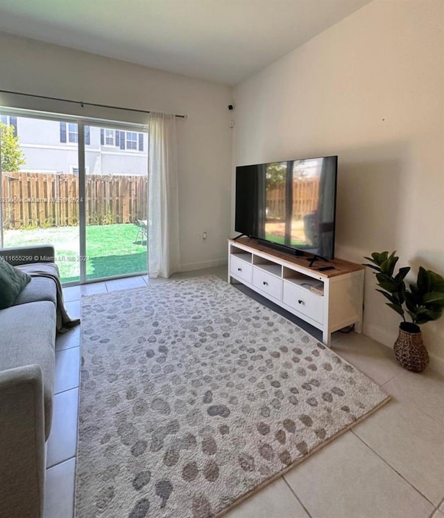 living room featuring light tile patterned floors and a wealth of natural light