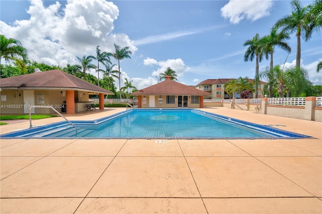 view of swimming pool with a patio