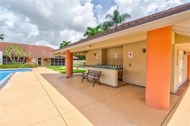 view of patio / terrace featuring a community pool