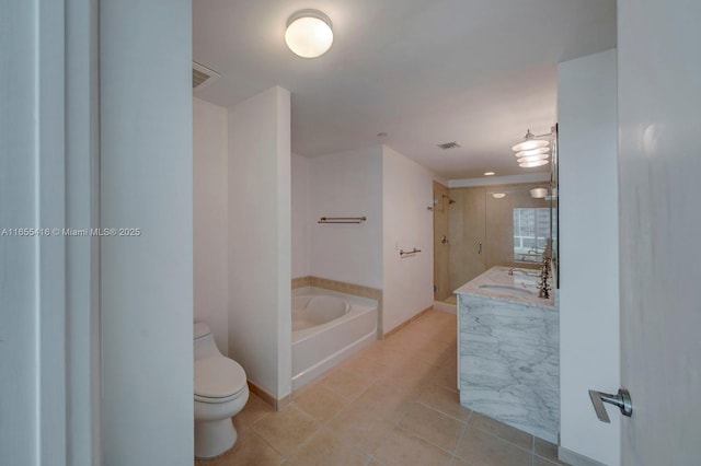 full bathroom with tile patterned flooring, shower with separate bathtub, vanity, and toilet