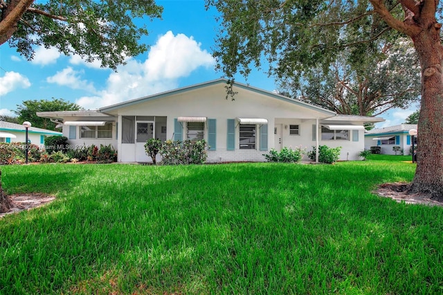 ranch-style house featuring a front lawn