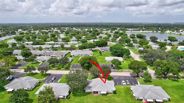 birds eye view of property featuring a residential view and a water view