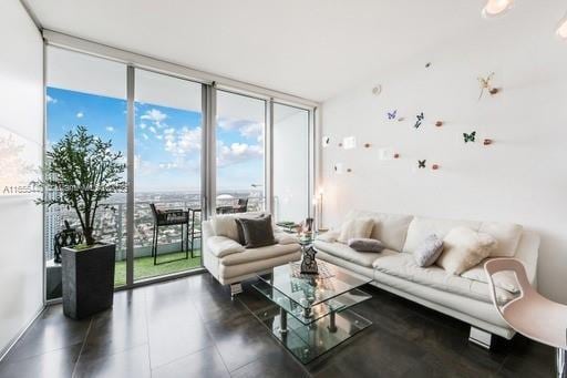 living room with floor to ceiling windows