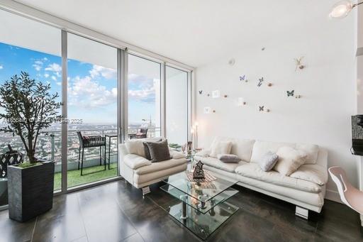 living room with a wall of windows