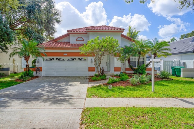 mediterranean / spanish-style home with a garage and a front lawn