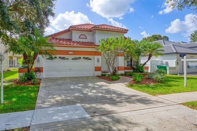 mediterranean / spanish-style home featuring a front lawn