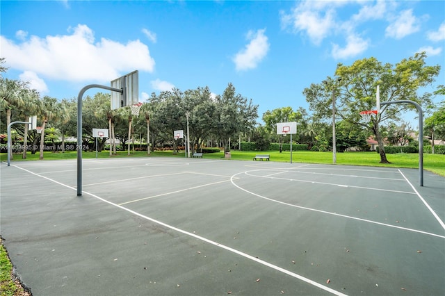 view of sport court featuring a yard