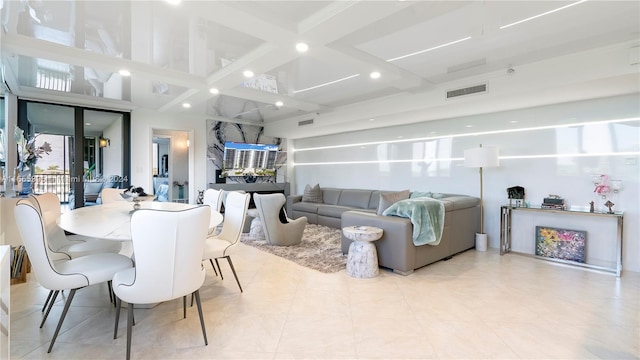 dining area with coffered ceiling, a wealth of natural light, and beam ceiling