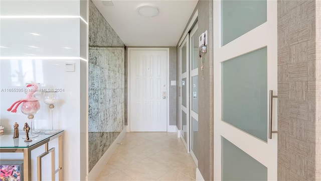 hallway with light tile patterned flooring