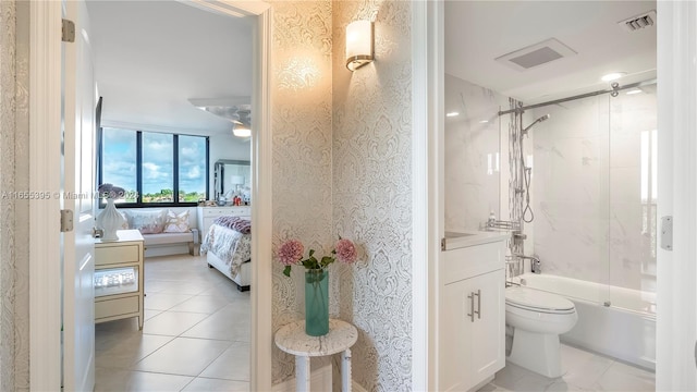 full bathroom with tile patterned floors, toilet, bath / shower combo with glass door, and vanity