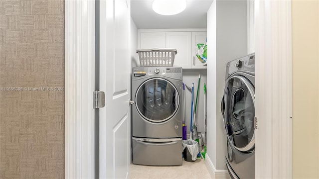 clothes washing area featuring washer / dryer