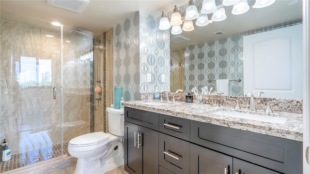 bathroom with tile patterned flooring, vanity, toilet, and an enclosed shower