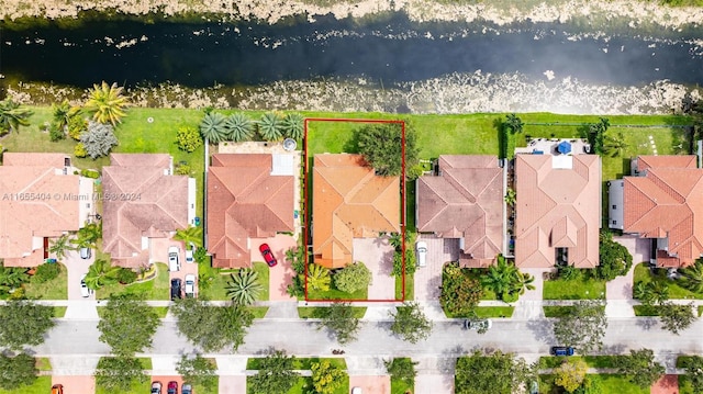 birds eye view of property featuring a water view