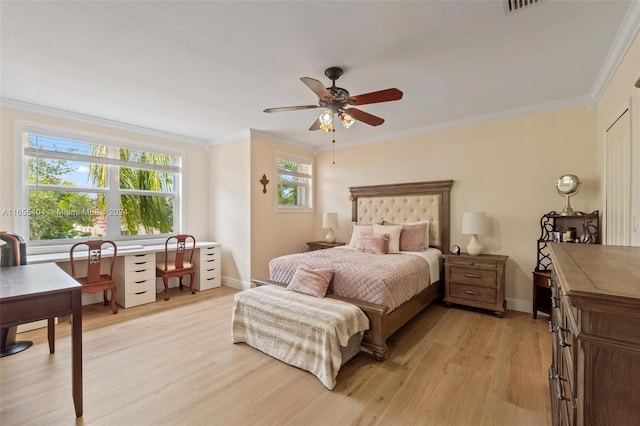 bedroom featuring ceiling fan, light hardwood / wood-style floors, and ornamental molding