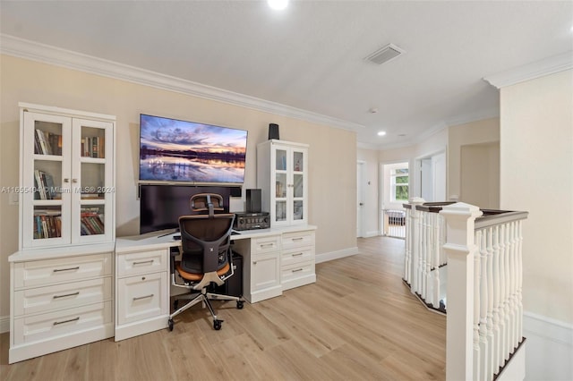 office space with crown molding and light wood-type flooring