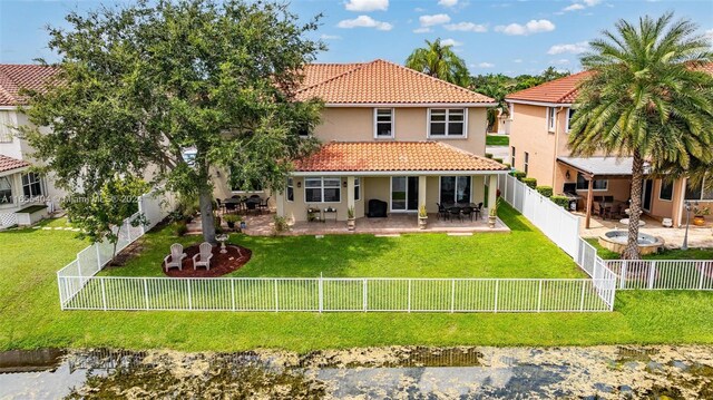 back of property featuring a patio