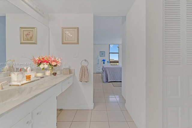 bathroom with tile patterned floors and vanity