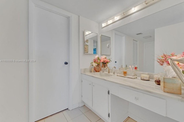 bathroom with tile patterned floors and vanity