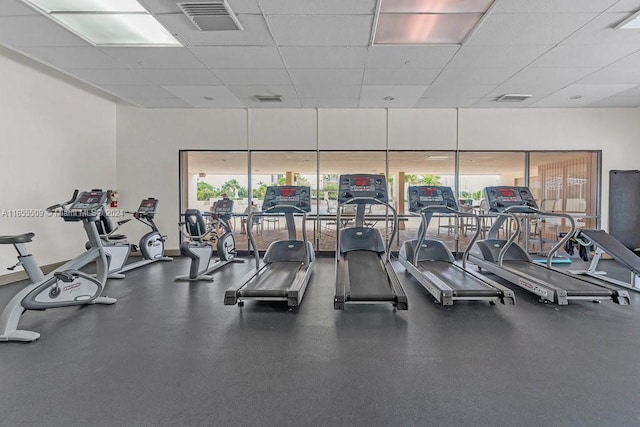 exercise room with a drop ceiling