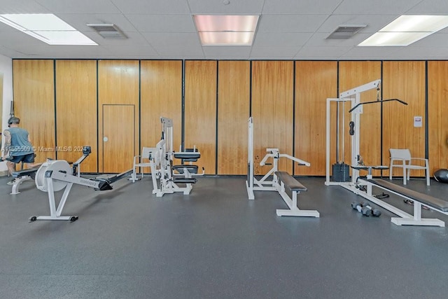 exercise room featuring a drop ceiling