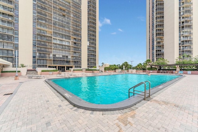 view of swimming pool with a patio