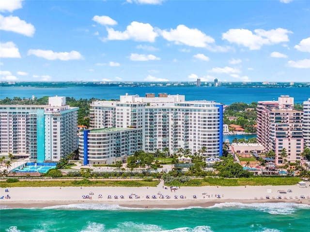 bird's eye view featuring a view of city, a beach view, and a water view