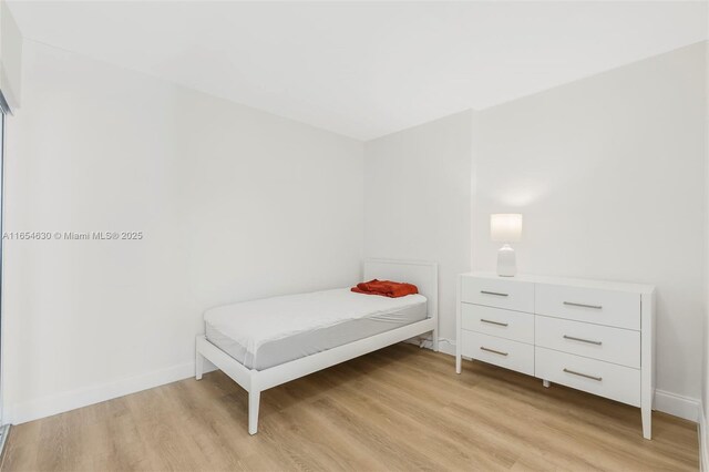 spare room featuring light wood-type flooring