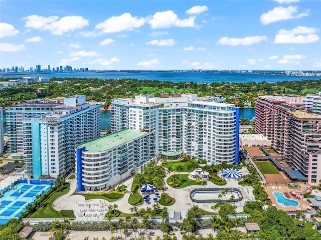 birds eye view of property featuring a view of city and a water view