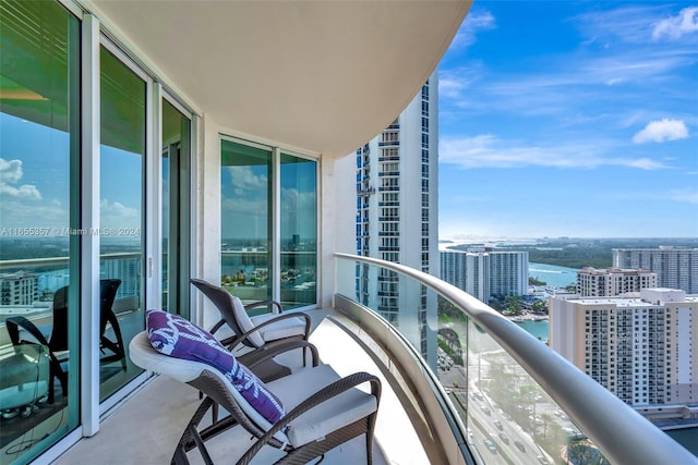 balcony featuring a water view